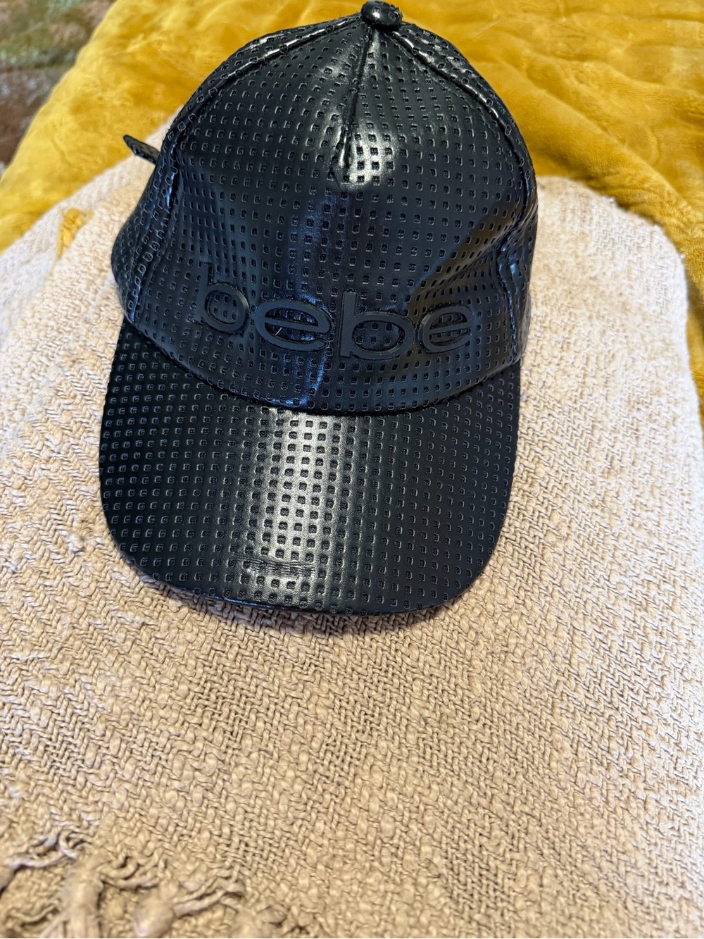 bebe Black Perforated Faux Leather Baseball Cap with Silver Logo Plate